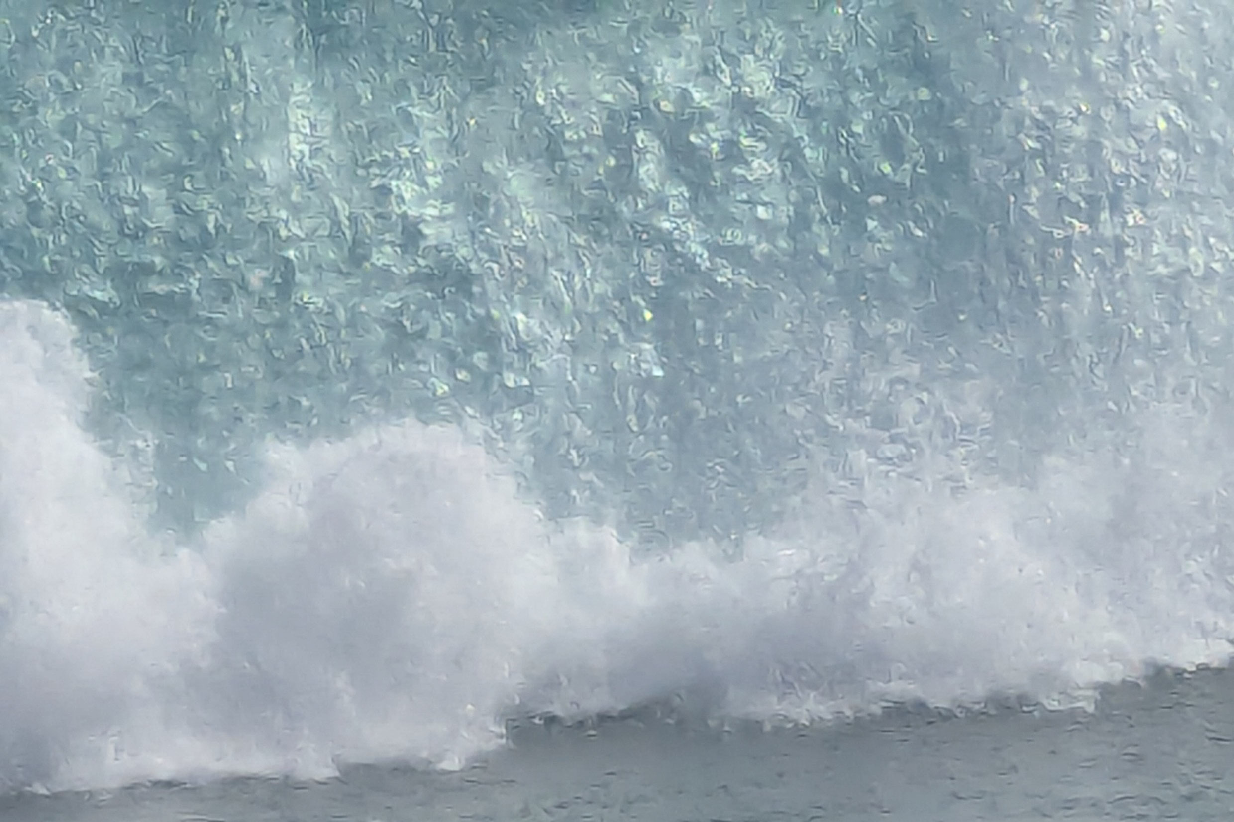 Overprocessed photo of a crashing wave